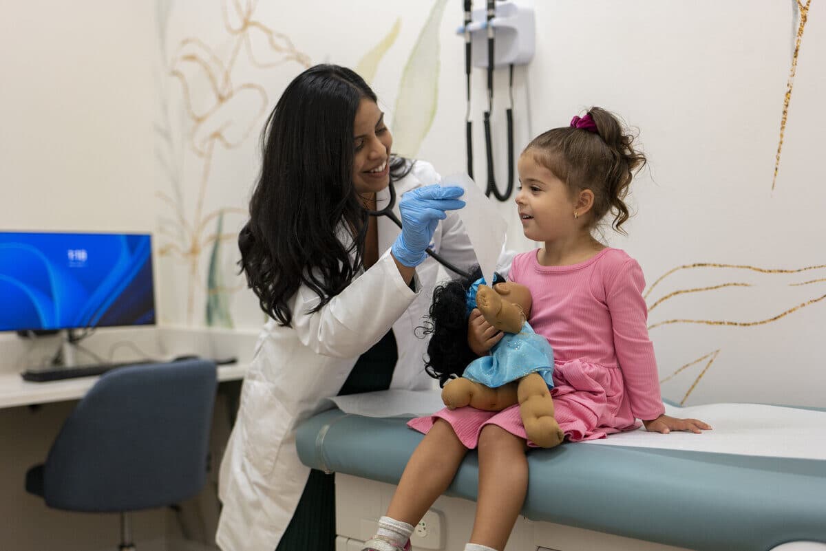 Board-certified pediatrician Dr. Patel with young patient during visit at Hummingbird Pediatrics Robbinsville NJ