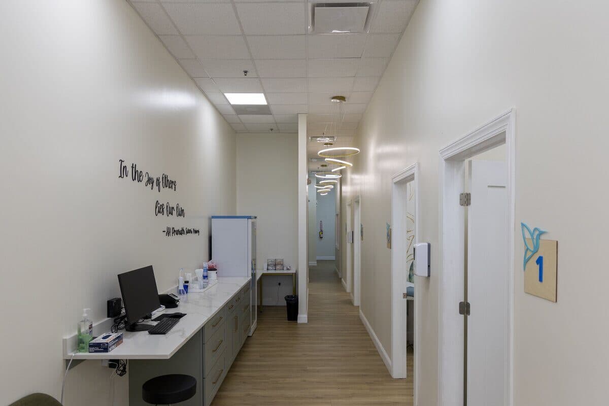 Clean, modern hallway at Hummingbird Pediatrics with inspirational quote - family-friendly pediatric practice Princeton NJ area