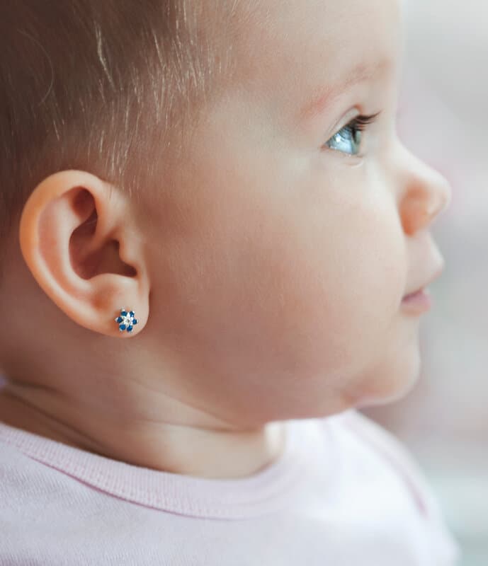 Medical ear piercing procedure in sterile pediatric clinic in Robbinsville Hamilton area