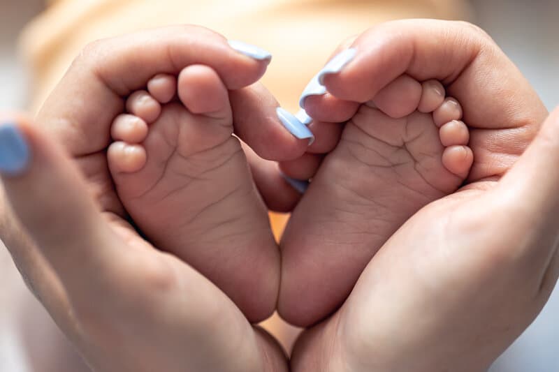 Newborn examination by pediatrician in gentle, caring environment